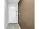 Entryway with neutral paint, gray tile flooring, and a white front door at 650 Island Way # 204, Clearwater Beach, FL 33767