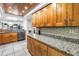 Updated kitchen with sleek cabinets, granite countertops and stainless-steel appliances at 650 Island Way # 204, Clearwater Beach, FL 33767