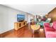 Bright living room with hardwood floors, colorful furniture, and a waterfront view at 650 Island Way # 204, Clearwater Beach, FL 33767