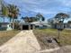 Charming single-story home featuring an attached garage and a well-maintained front yard at 6706 Del Prado Ter, New Port Richey, FL 34652