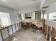 Kitchen featuring white cabinets and damage at 6706 Del Prado Ter, New Port Richey, FL 34652