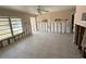 View of the living room featuring a large window that provides plenty of natural light at 6706 Del Prado Ter, New Port Richey, FL 34652