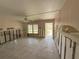 View of the living room featuring tile floors and a ceiling fan at 6706 Del Prado Ter, New Port Richey, FL 34652
