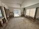 View of the living room featuring tile flooring and a sliding glass door at 6706 Del Prado Ter, New Port Richey, FL 34652
