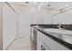 Bathroom boasts a double vanity with granite countertops and a large mirror at 7205 Ronnie Gardens Ct, Tampa, FL 33619
