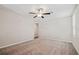 Bonus room with neutral carpet, a ceiling fan, and a view to the hallway at 7205 Ronnie Gardens Ct, Tampa, FL 33619