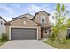Charming two-story home features a two-car garage and well-maintained landscaping at 7205 Ronnie Gardens Ct, Tampa, FL 33619