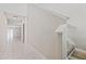 Bright hallway features tile floors and leads to multiple rooms at 7205 Ronnie Gardens Ct, Tampa, FL 33619