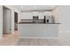 Bright kitchen with white cabinets, stainless steel appliances, and granite countertops at 7205 Ronnie Gardens Ct, Tampa, FL 33619