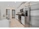 Kitchen with stainless steel appliances and stylish granite countertops at 7205 Ronnie Gardens Ct, Tampa, FL 33619