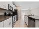 Well-equipped kitchen featuring stainless steel appliances and granite countertops at 7205 Ronnie Gardens Ct, Tampa, FL 33619