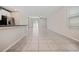 Open-concept living area with tile flooring and natural light at 7205 Ronnie Gardens Ct, Tampa, FL 33619