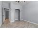 This bedroom has tile floor, an open closet and multiple windows at 8605 N Taliaferro Ave, Tampa, FL 33604