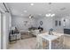 Open-concept living and dining area filled with natural light, perfect for entertaining at 8605 N Taliaferro Ave, Tampa, FL 33604