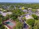 Aerial view of a waterfront condo community with tennis courts and mature landscaping at 9100 Dr Martin Luther King Jr N St # 314, St Petersburg, FL 33702