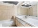 Bathroom features a white vanity, tile walls, and a shower/tub combo at 9100 Dr Martin Luther King Jr N St # 314, St Petersburg, FL 33702