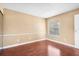 Empty bedroom showcases wood floors, a window, and neutral walls, ready for personalization at 9100 Dr Martin Luther King Jr N St # 314, St Petersburg, FL 33702