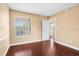 An empty bedroom showcasing hardwood floors and natural light from the window at 9100 Dr Martin Luther King Jr N St # 314, St Petersburg, FL 33702