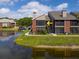 Waterfront condo features screened balconies and brick accents, offering serene views and outdoor living at 9100 Dr Martin Luther King Jr N St # 314, St Petersburg, FL 33702