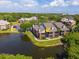 Charming condo building overlooking a serene lake, surrounded by lush green trees and well-maintained landscaping at 9100 Dr Martin Luther King Jr N St # 314, St Petersburg, FL 33702