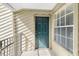 The front door is painted teal and has the unit number 314 clearly displayed at 9100 Dr Martin Luther King Jr N St # 314, St Petersburg, FL 33702