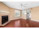Cozy living room with hardwood floors, fireplace, and view of the kitchen at 9100 Dr Martin Luther King Jr N St # 314, St Petersburg, FL 33702