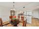 Contemporary dining area featuring a glass table and open layout to the kitchen at 960 Starkey Rd # 7202, Largo, FL 33771