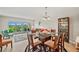 Elegant dining area with bright, natural light and golf course views from the sliding glass doors at 960 Starkey Rd # 7202, Largo, FL 33771