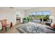 Inviting living room with access to balcony, neutral walls, wood-look flooring, and stylish furniture at 960 Starkey Rd # 7202, Largo, FL 33771