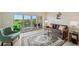 Bright living room with sliding glass doors to balcony, neutral tones, and comfortable furniture at 960 Starkey Rd # 7202, Largo, FL 33771