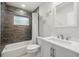 Bathroom features wood look tile, updated white vanity, and decorative starfish at 1047 Deer Hollow Way, Sarasota, FL 34232