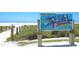 Siesta Beach sign, named the number one beach in the USA, with a sunny beach in the background at 1047 Deer Hollow Way, Sarasota, FL 34232