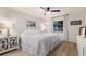 Bedroom with a ceiling fan, neutral paint colors and a window with natural light at 1047 Deer Hollow Way, Sarasota, FL 34232