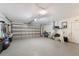 Spacious garage with epoxy flooring and ample storage space at 1047 Deer Hollow Way, Sarasota, FL 34232