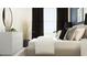 Cozy bedroom featuring a well-lit room and decorative pieces with a modern feel at 10825 Fort White Ct, Tampa, FL 33647