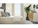 Bright bedroom featuring a comfortable bed, modern furnishings, and a large window with natural light at 10825 Fort White Ct, Tampa, FL 33647