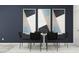 Dining room featuring a modern table with seating for six, accentuated by striking abstract art at 10825 Fort White Ct, Tampa, FL 33647