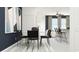 Open-concept living space with modern dining area and cozy living room, creating an inviting atmosphere at 10825 Fort White Ct, Tampa, FL 33647