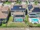 An aerial view of home with large screened in pool and solar panels at 11227 Hawks Fern Dr, Riverview, FL 33569