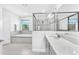 Bright bathroom showcasing a soaking tub, frameless shower, and granite countertops at 11227 Hawks Fern Dr, Riverview, FL 33569
