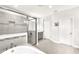 Elegant bathroom with a soaking tub, a glass-enclosed shower, and modern finishes at 11227 Hawks Fern Dr, Riverview, FL 33569