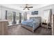 Bedroom featuring large windows, a ceiling fan, and contemporary furnishings at 11227 Hawks Fern Dr, Riverview, FL 33569