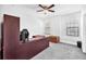 Bright bedroom with a large desk, ceiling fan, and two large windows letting in lots of light at 11227 Hawks Fern Dr, Riverview, FL 33569