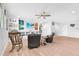 Spacious bonus room with hardwood floors and a ceiling fan, perfect for relaxing or entertaining at 11227 Hawks Fern Dr, Riverview, FL 33569