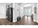 Light and airy foyer with stylish wood-look tile flooring and a charming bench at 11227 Hawks Fern Dr, Riverview, FL 33569