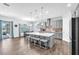 Spacious kitchen with gray cabinetry, an island with seating, and stainless steel appliances at 11227 Hawks Fern Dr, Riverview, FL 33569