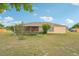 The backyard featuring a screened lanai is perfect for outdoor relaxation and enjoying the fresh air at 12124 Colonial Estates Ln, Riverview, FL 33579