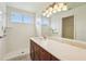 Bathroom featuring a step-in shower, vanity, and large mirror at 12124 Colonial Estates Ln, Riverview, FL 33579