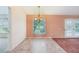 Bright dining area with tiled floor and door, offering easy access to outdoor spaces at 12124 Colonial Estates Ln, Riverview, FL 33579