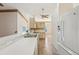 Kitchen with white appliances, bright cabinets, and ample counter space at 12124 Colonial Estates Ln, Riverview, FL 33579